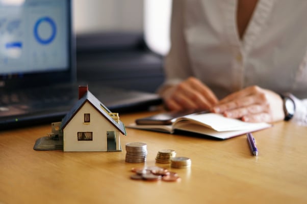 closeup-shot-person-thinking-buying-selling-house