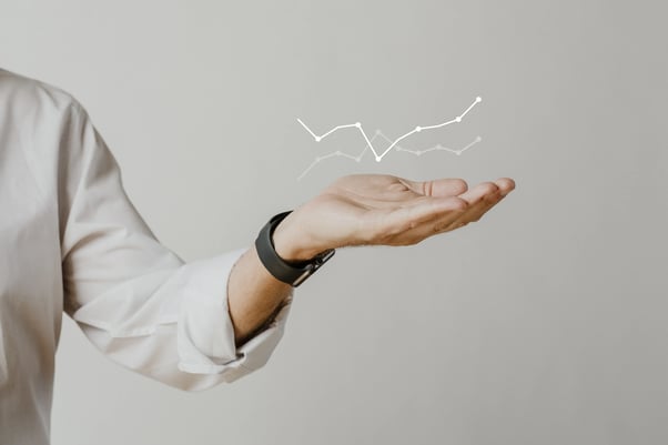 digital-graph-with-businessman-hand-overlay