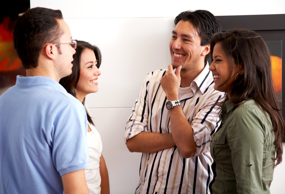 group of friends in an apartment talking