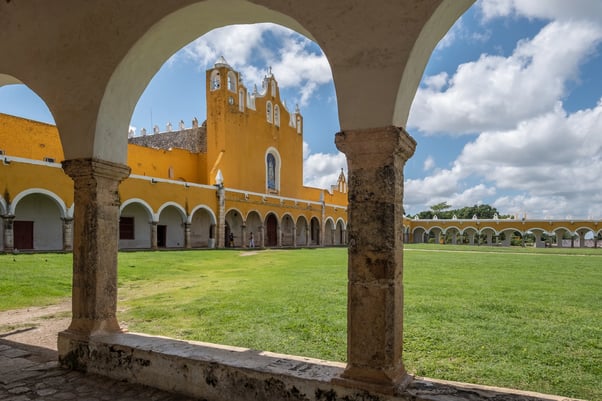 view-through-arch-way-church-tower-monastery-izamal